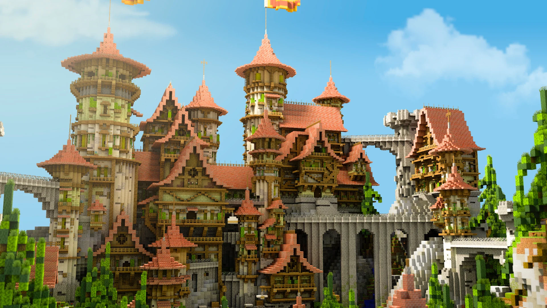 Sprawling castle hub with salmon-pink rooftops, towers and connecting bridges under a blue sky
